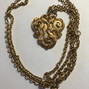 Vintage Trifari gold toned swirl pendant with double chain necklace